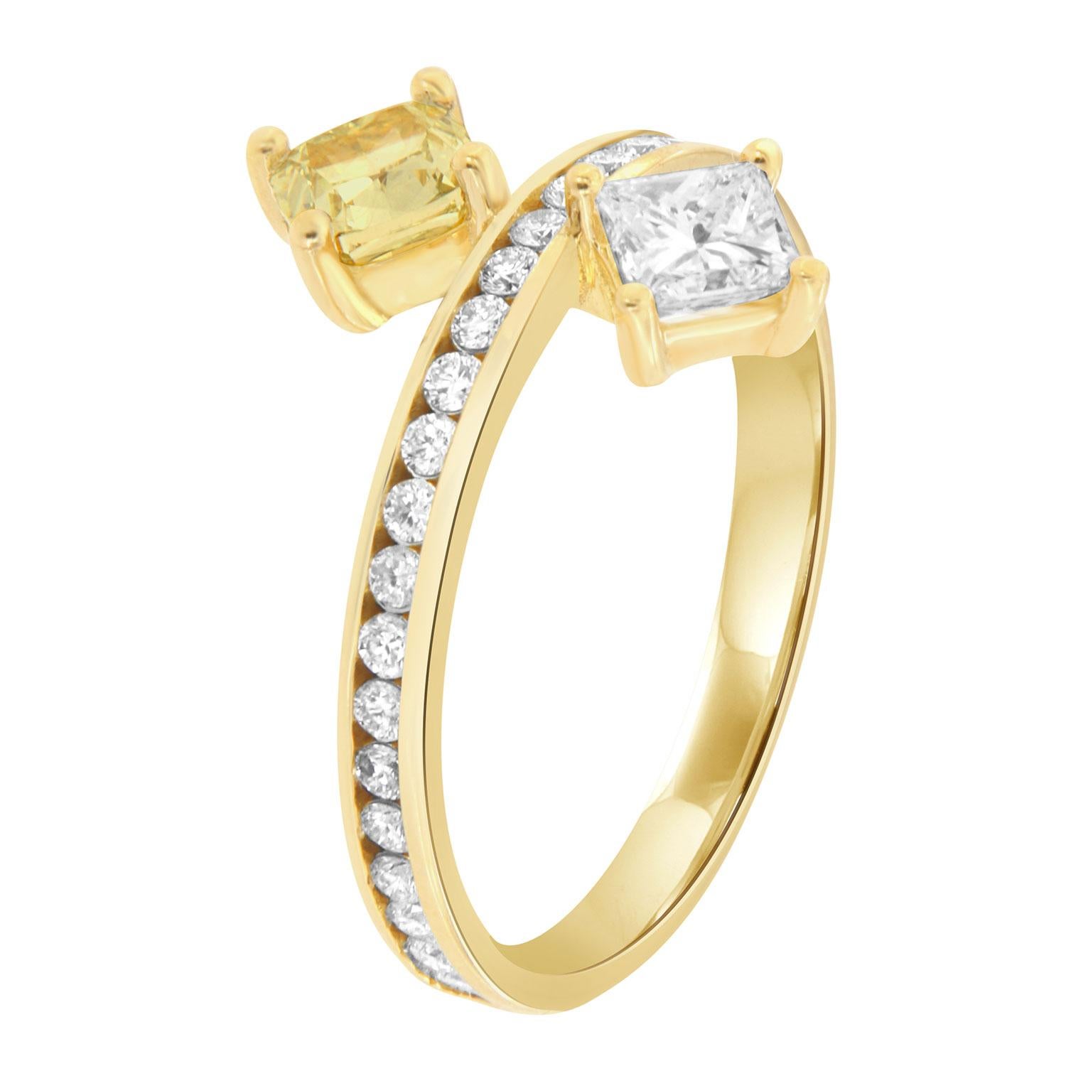 This Fashionable ring features a 0.52 Cushion Shape Yellow Diamond GIA Certified four (4) prong set across of 0.38-carat princess shape white diaomnd on top of 2.3 mm wide band.  Brilliant round diamonds in weight of 0.35 carat are channel set on