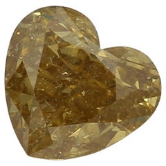 Diamante certificado por GIA de 0,52 quilates de color amarillo parduzco intenso con claridad I2