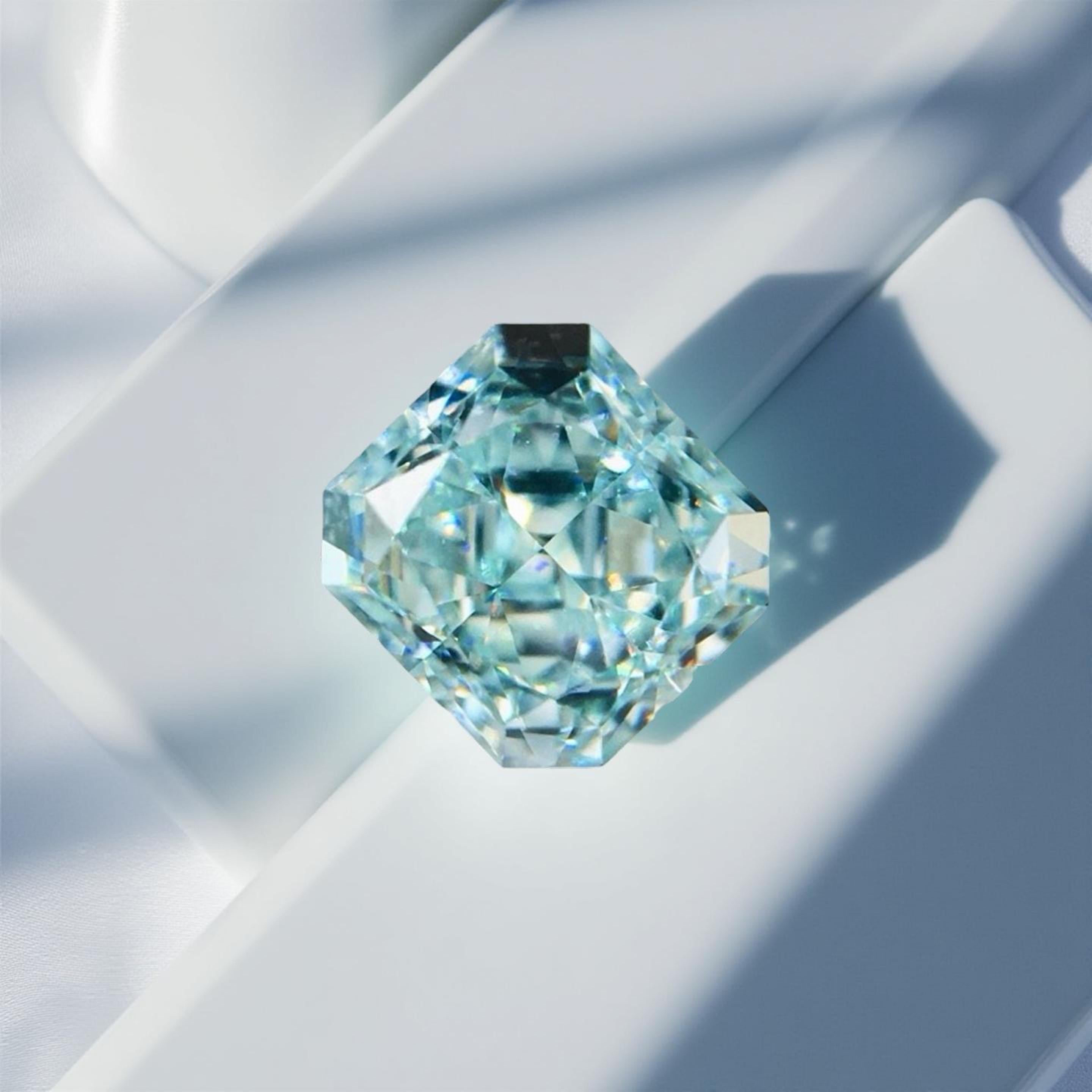 SMALL, yet Amazing, Elegant and Sophisticated. 
An exquisite natural blue diamond that shimmers like a tropical sea. This rare 0.52 carat radiant-cut diamond has been graded by GIA as Fancy Greenish Blue, with natural color origin and VS1 clarity.