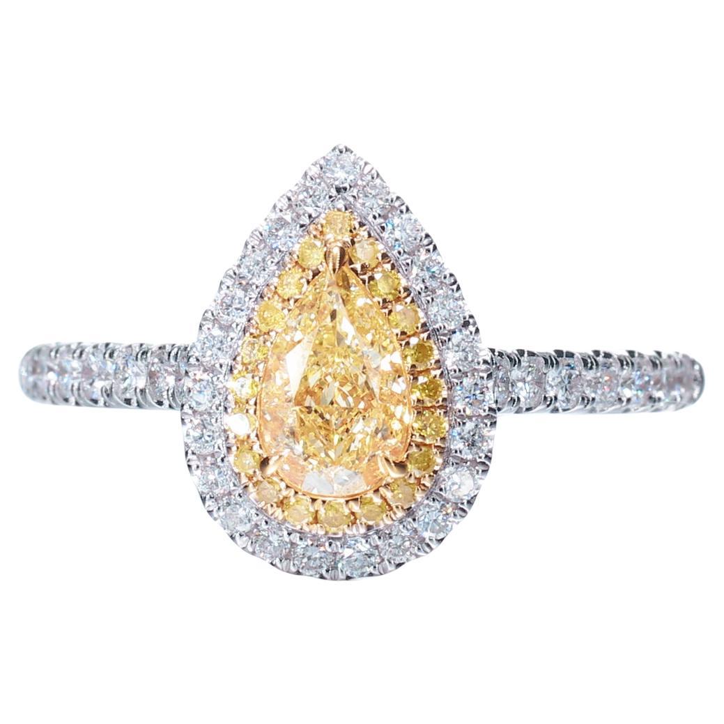 GIA Certified, 0.55 Natural Fancy Light Yellow Pear Shape diamond Solitaire Ring