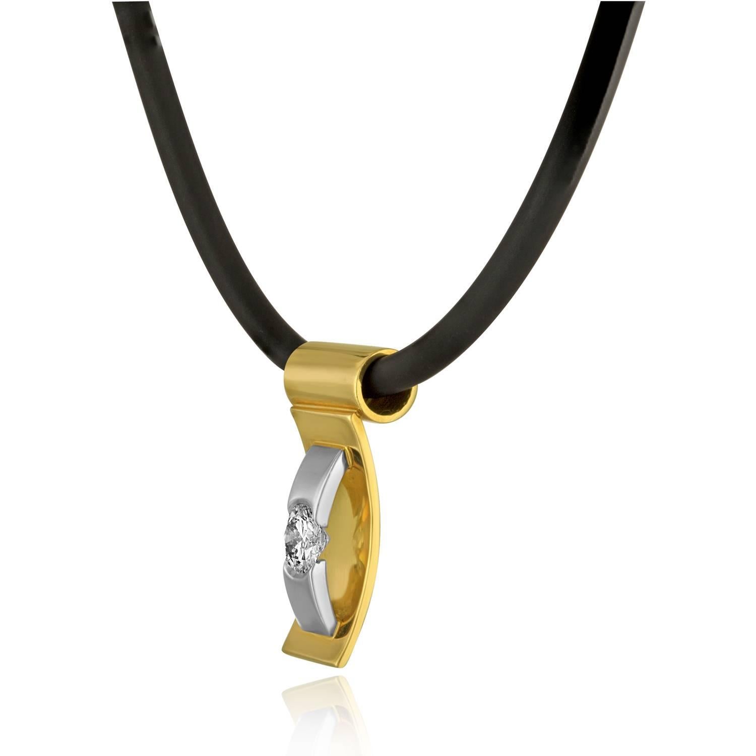 Very Unusual & Abstract Unisex Necklace.
The pendant / Slide is 18K Yellow & White Gold
The round stone is GIA certified F SI1 0.57 Carats
The pendant/slide hangs on a rubber necklace.
The necklace measures 18.5