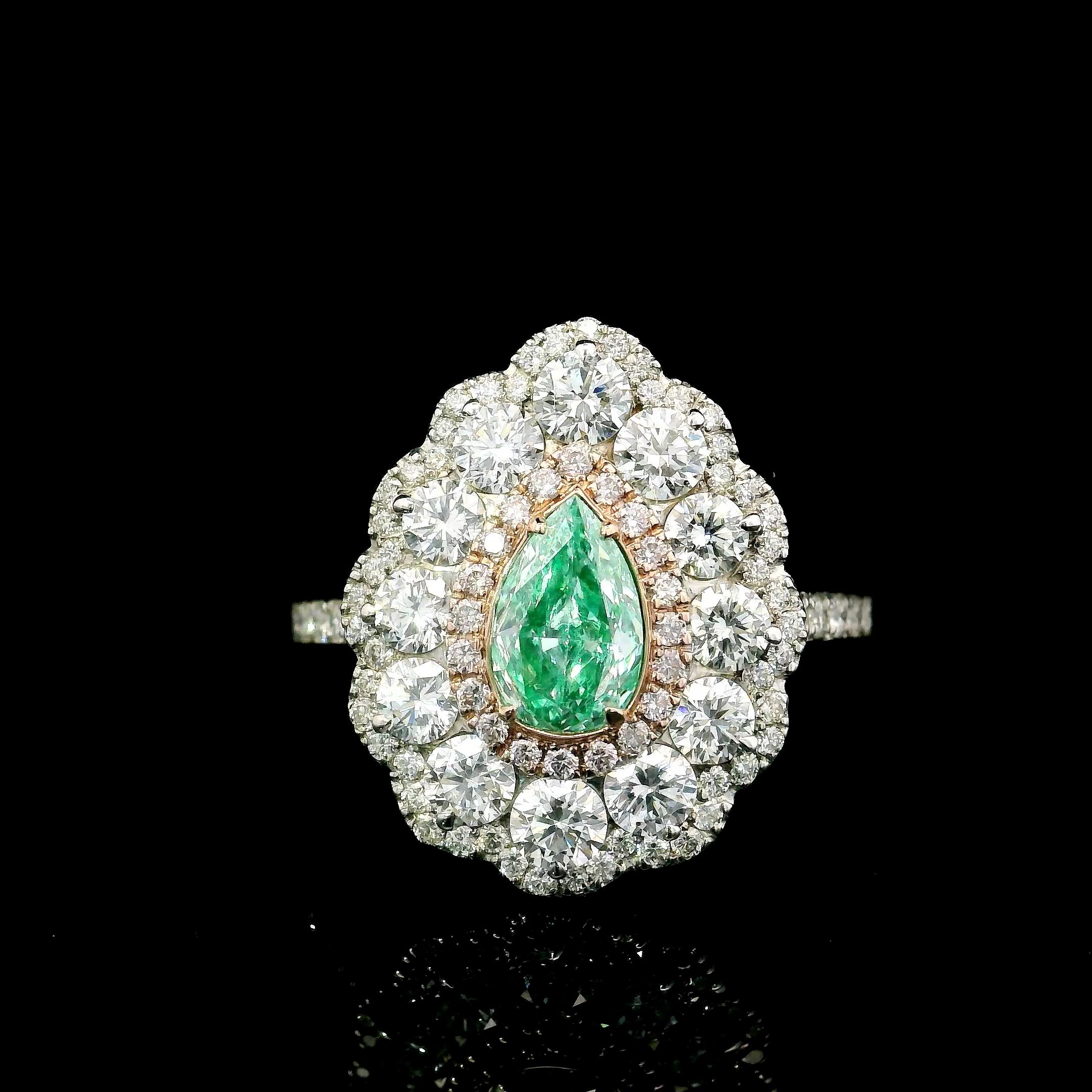 18kt white gold ring with diamonds
  
  Gold colour & karat: White gold 18kt
  Weight: 6.954 grams
  
  Set with-
  Stone type: Diamonds
  Shape: Pear
  Carat: 0.57 ct 
  Colour: Fancy Light Bluish Green
  Clarity: SI2

  Surrounding Stones: