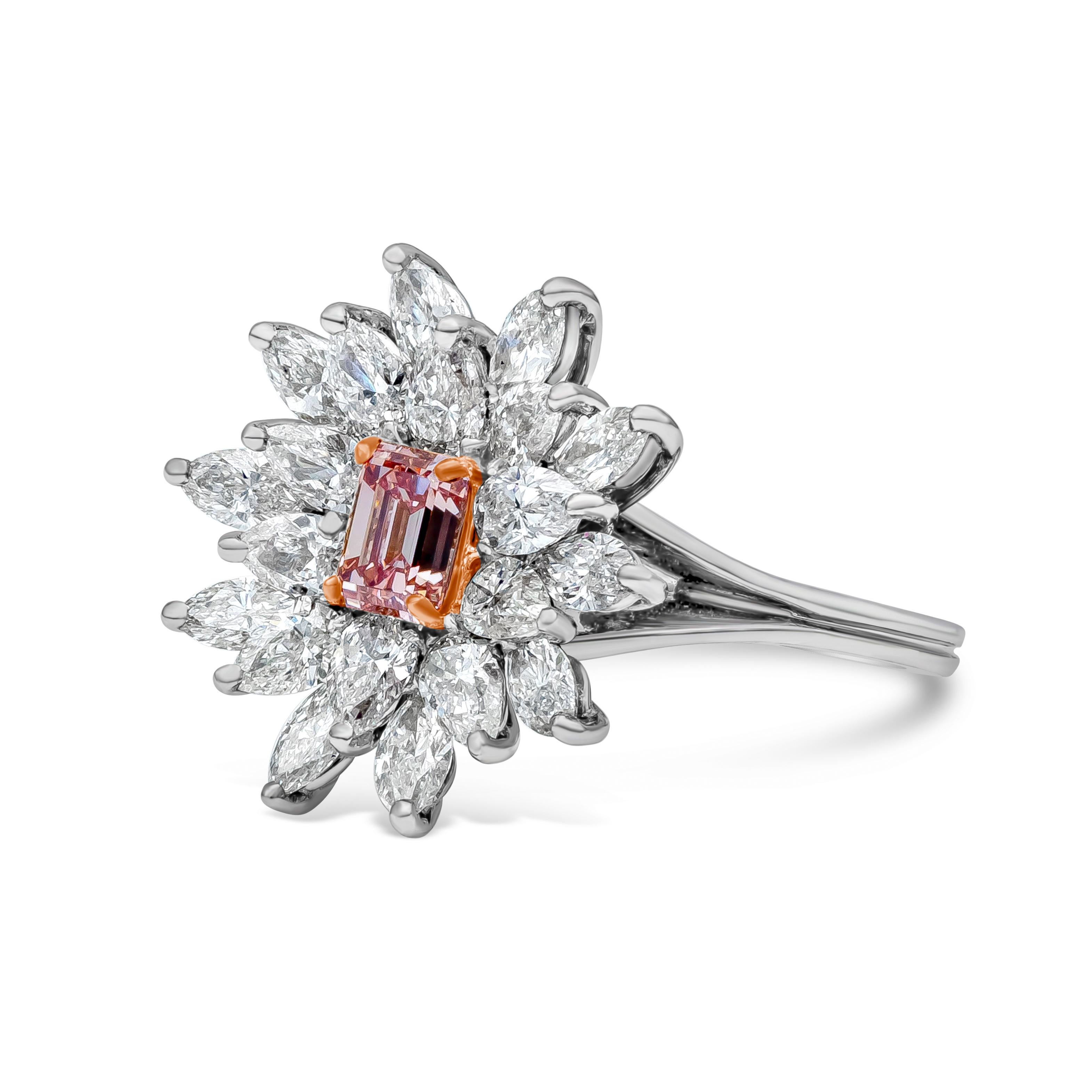 A lively and unique ring showcasing a GIA Certified 0.59 carat emerald cut, Fancy Intense Pink Color and  VS1 in Clarity. The gorgeous pink diamond is surrounded by clusters of sparkling marquise and pear shaped diamonds weighing 2 carats total. Set