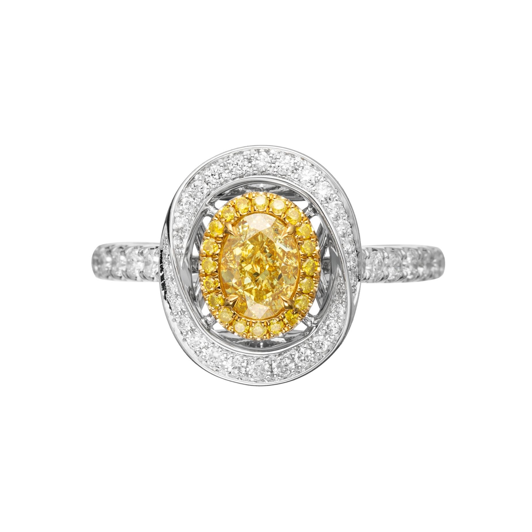 Unlock the pinnacle of luxury and love with this 0.59ct Fancy Intense Yellow natural oval-shaped diamond ring in resplendent 18kt gold. A symbol of enduring commitment, this masterpiece is the perfect gift for wedding and engagement ceremonies,