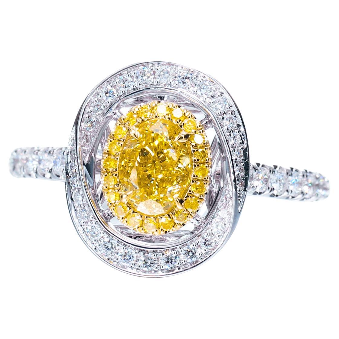 Bague de diamants de forme ovale 18 carats, certifiée GIA, de couleur naturelle jaune intense de 0,59 carat
