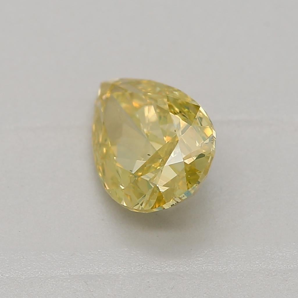 Pear Cut GIA Certified 0.60 Carat Fancy Intense Yellow SI2 Clarity Diamond For Sale