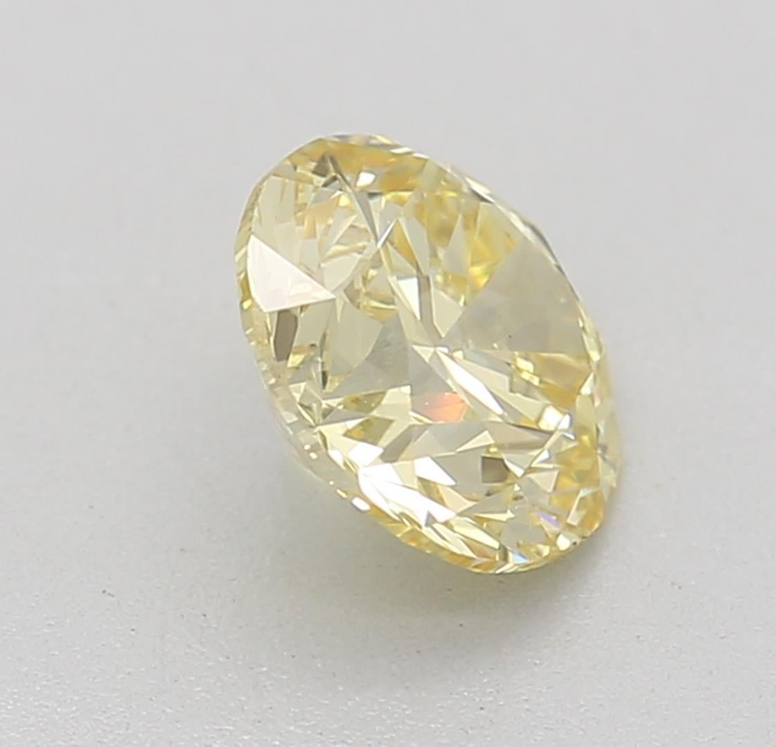 Women's or Men's GIA Certified 0.60 Carat Fancy Yellow SI1 Clarity Diamond For Sale