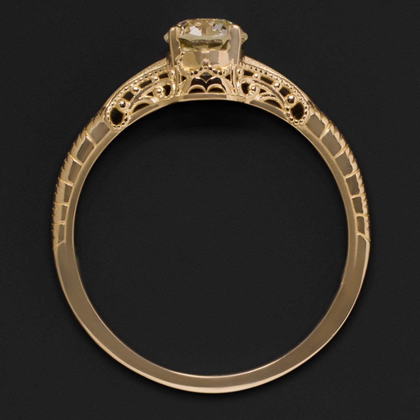 Ring with a 0.60 ct antique European cut diamond set in a classic design 18k yellow gold mounting.
The diamond is certified by the GIA, graduated M in color and SI1 in clarity; it is a completely clean stone to the naked eye.