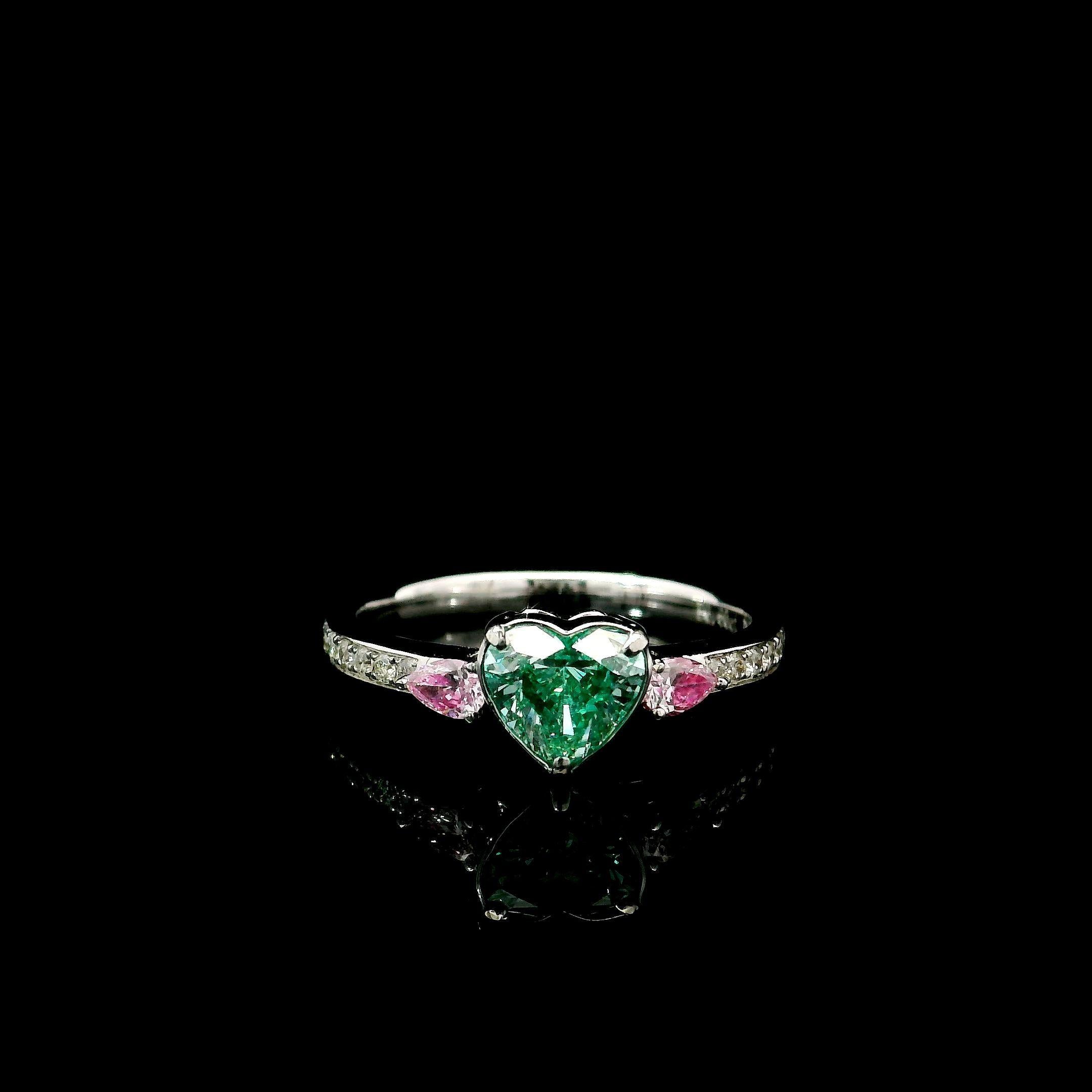 18kt white gold ring with diamonds
  
  Gold colour & karat: White gold 18kt
  Weight: 2.46 grams
  
  Set with-
  Stone type: Diamonds
  Shape: Heart
  Carat: 0.60 ct
  Colour: Very Light Green Yellow
  Clarity: SI2
  
  Surrounding Stones: