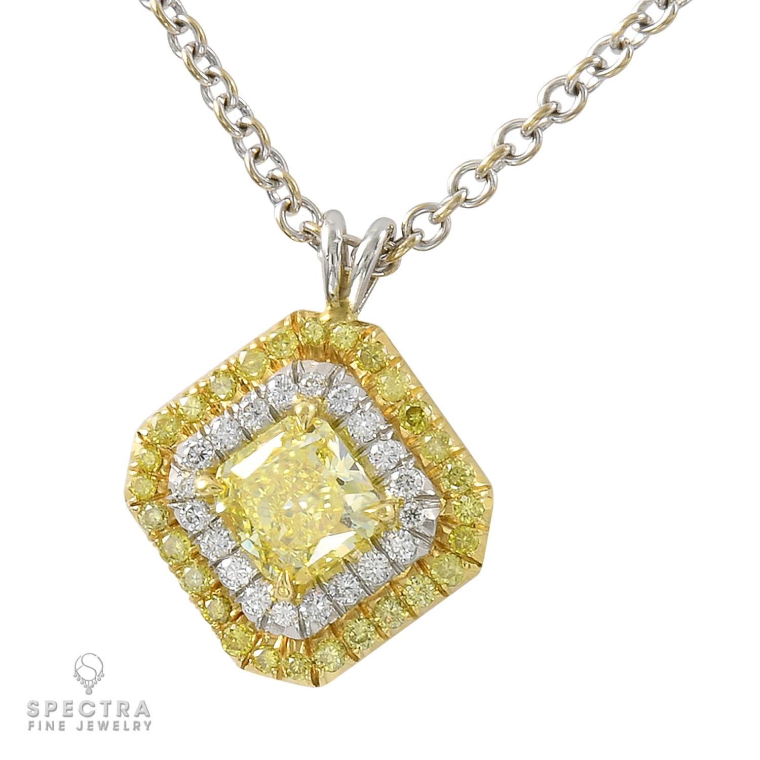 This pretty and delicate 18K white gold pendant necklace made by Spectra Fine Jewelry in the Contemporary Era, circa 2010s, features a fancy yellow colored radiant-cut diamond, weighing approximately 0.62 carat. The diamond is accompanied by report