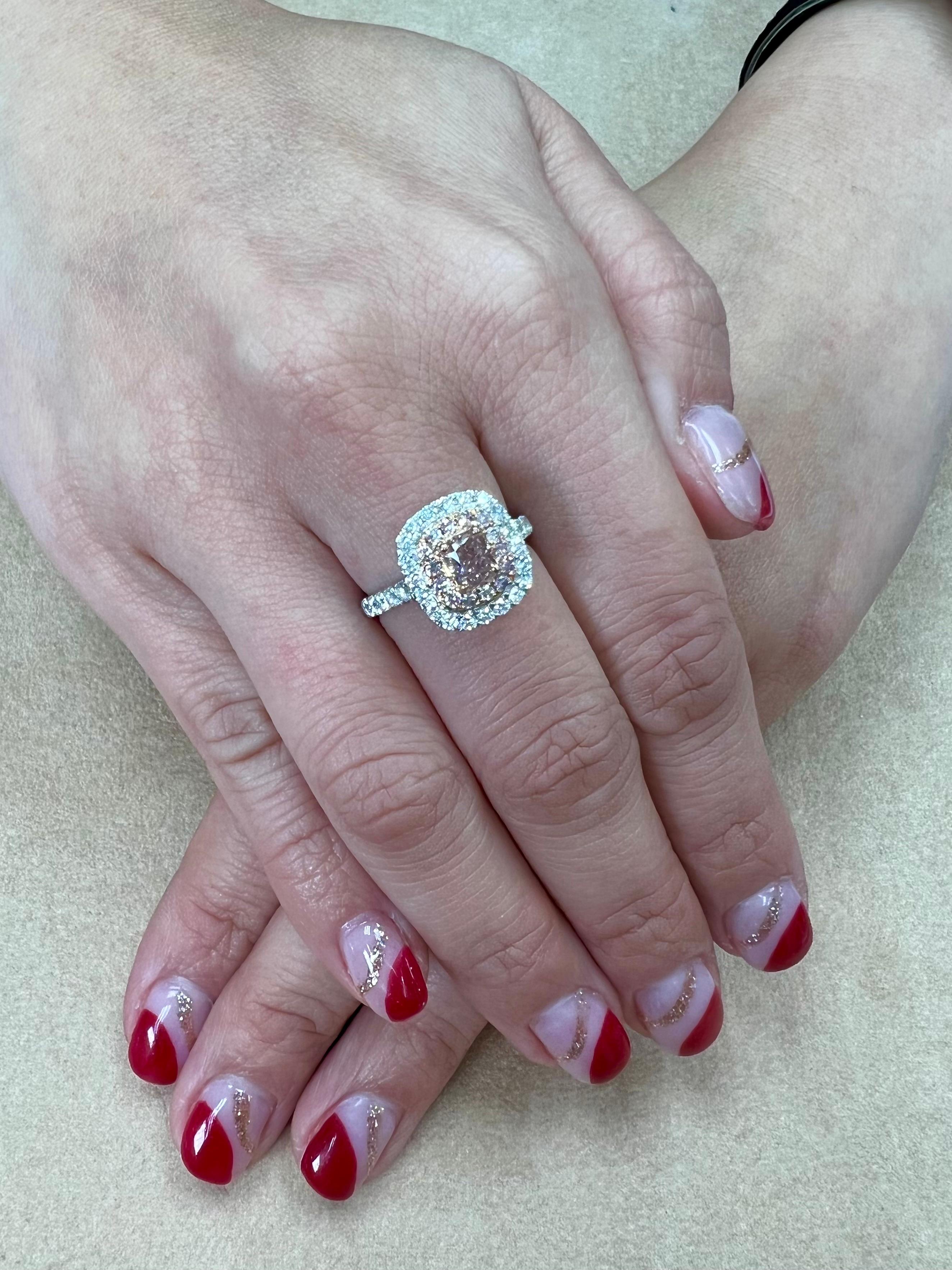 Please check out the HD video! Here is a nice fancy orange pink colored diamond cocktail ring. Two of the rare colors combined (orange and pink) The fancy orangy pink diamond is certified by GIA to be natural and untreated. The nice cushion shaped