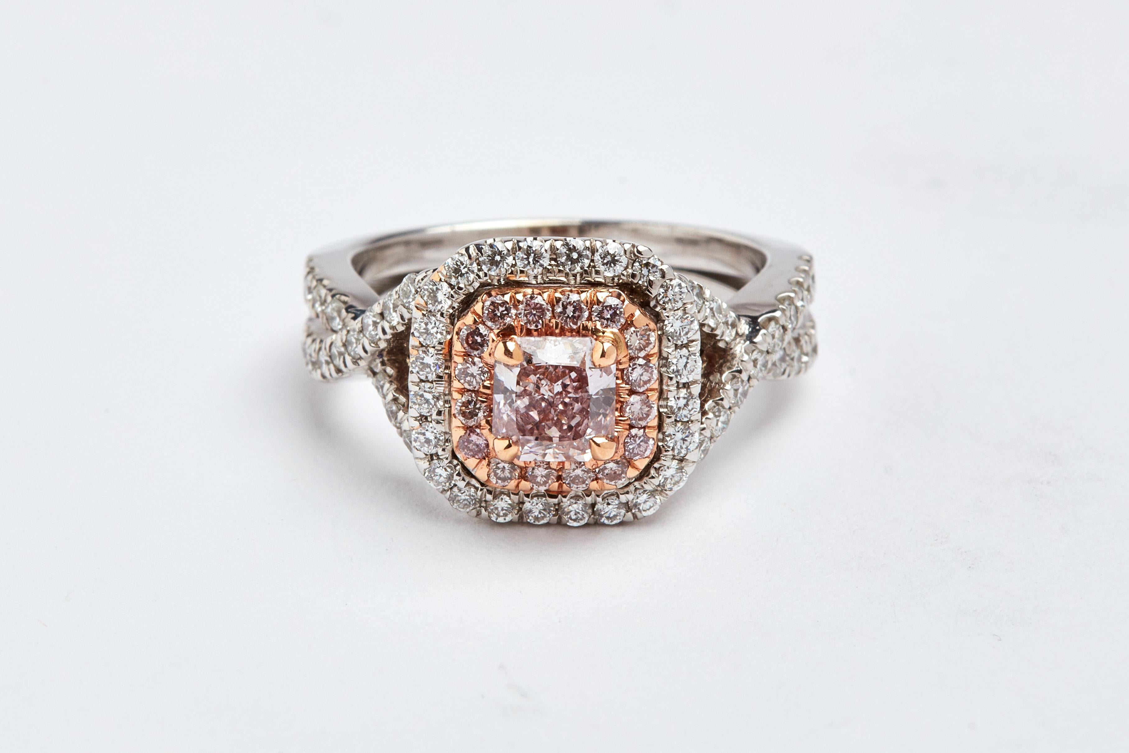 GIA Certified 0.62 carats Natural Brown Pink radiant cut diamond ring. Center stone is 0.62 carats and SI2 clarity.  aprox 0.20 carats in natural pink round stone around the center stone. aprox  0.75 carats of white round diamonds on the setting.