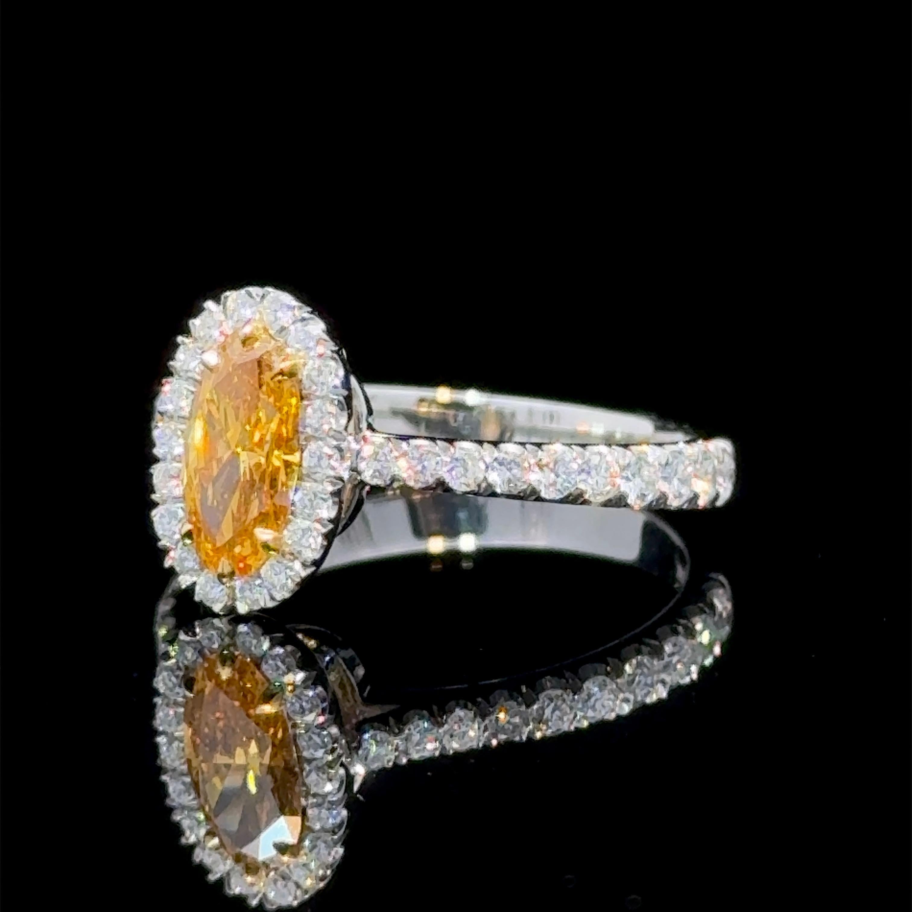 Oval Cut GIA Certified 0.62 Carat Natural Vivid Orange Diamond Halo Ring For Sale