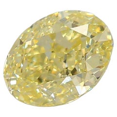GIA Certified 0.63 Carat Faint Light Yellow VS2 Clarity Diamond