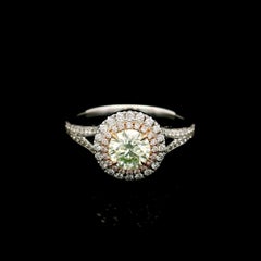 GIA Certified 0.64 Carat Fancy Light Yellow Green VS2 Clarity Diamond Ring