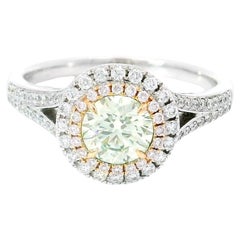 GIA Certified 0.64 Carat Fancy Light Yellow Green VS2 Clarity Diamond Ring