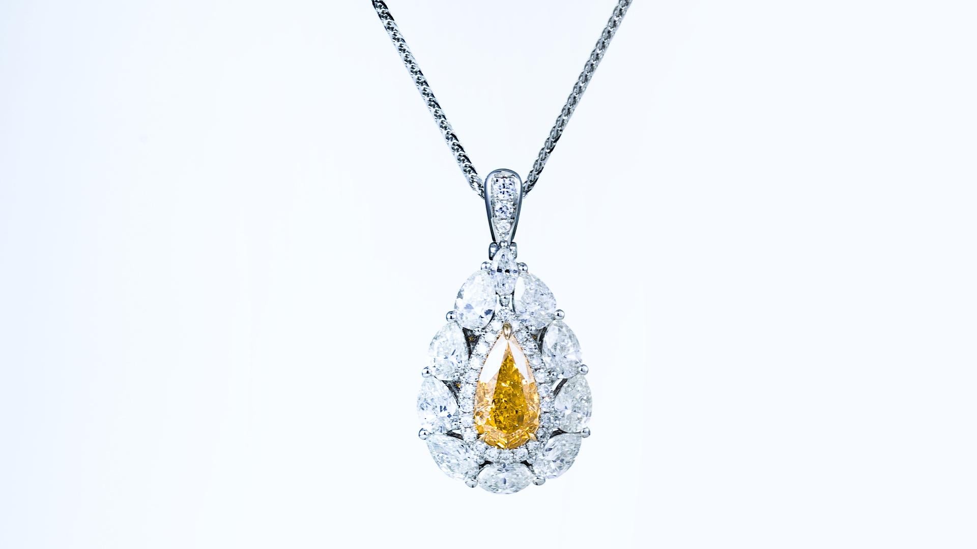 Pear Cut Gia Certified, 0.64ct, Natural Fancy Intense Orange-Yellow Diamond Ring 18 Karat For Sale