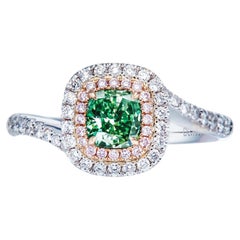 GIA Certified 0.67ct Very Light Yellow-Green Natural cushion shape diamond ring.
