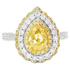 GIA Certified 0.68 Carat Fancy Light Yellow VS2 Clarity Diamond Ring