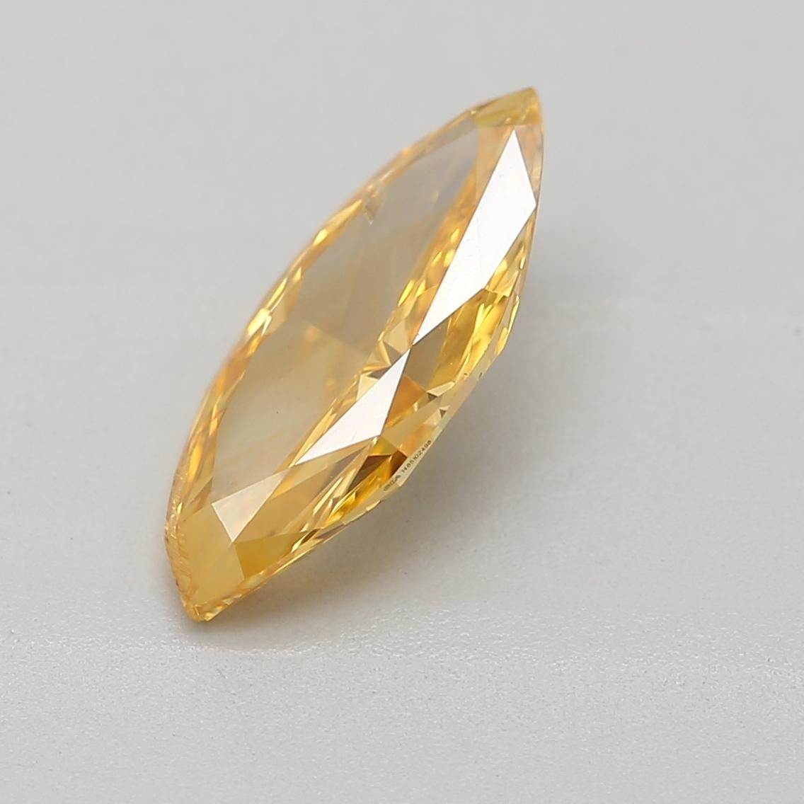Marquise Cut GIA Certified 0.69 Carat Fancy Vivid Orangy Yellow I1 Clarity Diamond For Sale
