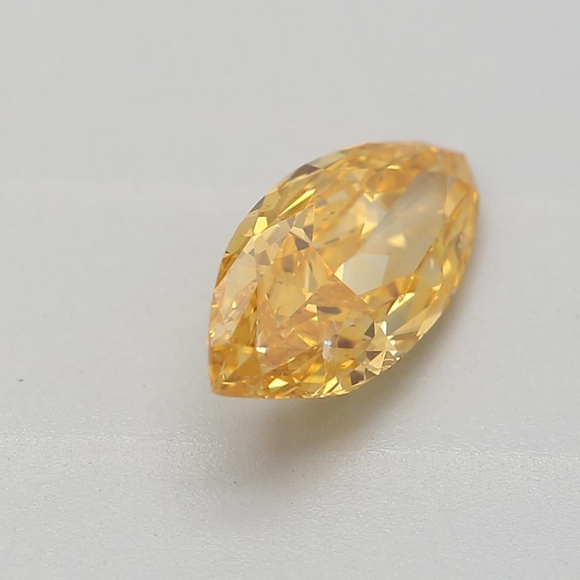 Women's or Men's GIA Certified 0.69 Carat Fancy Vivid Orangy Yellow I1 Clarity Diamond For Sale