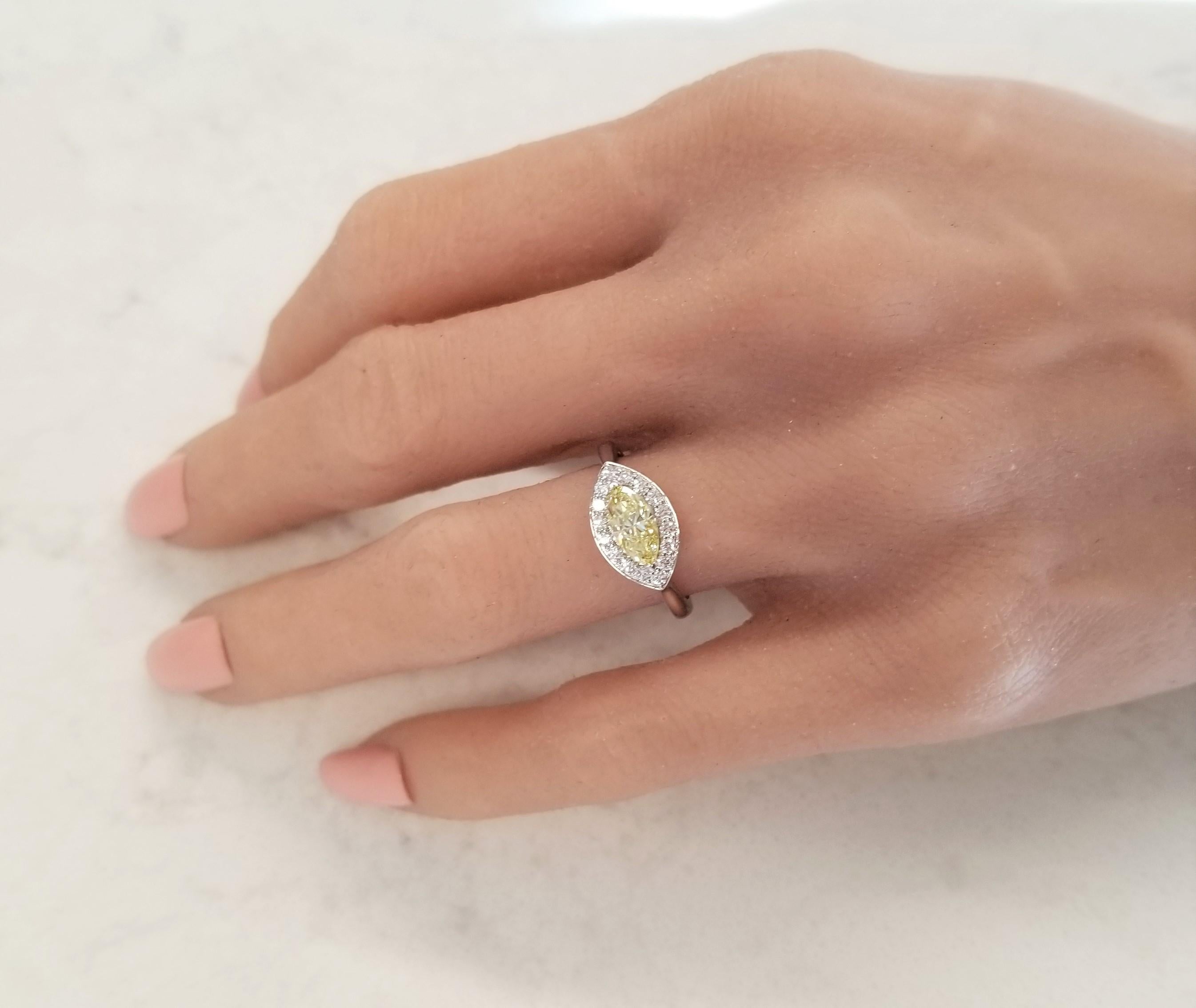 GIA Certified 0.69 Carat Marquise Fancy Intense Yellow Diamond Cocktail Ring For Sale 2