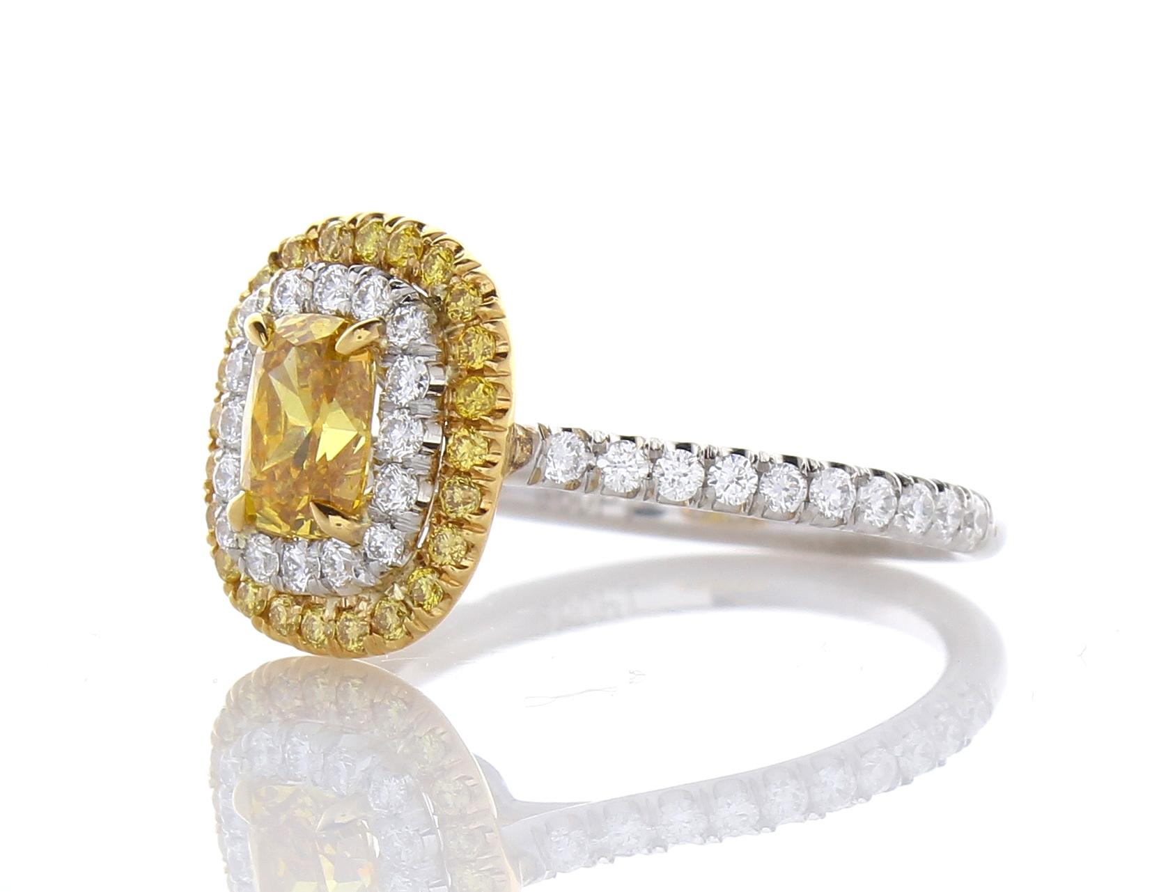 Two words: Alluring sophistication. This is a GIA certified 0.70 carat, cushion cut, natural fancy vivid orange-yellow diamond with an SI2 clarity. The color saturation is the highest it comes and is evenly distributed throughout. This unique