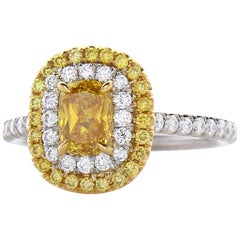 GIA Certified 0.70 Carat Cushion Cut Fancy Vivid Yellow Diamond Cocktail Ring