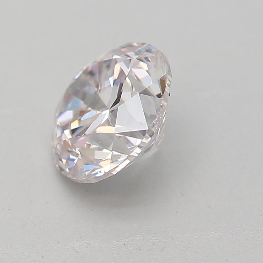 Round Cut GIA Certified 0.70 Carat Faint Pink SI1 Clarity Diamond For Sale