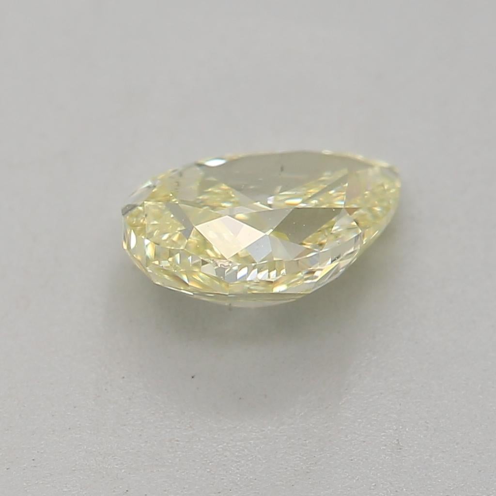 Pear Cut GIA Certified 0.70 Carat Fancy Light Yellow I1 Clarity Diamond For Sale