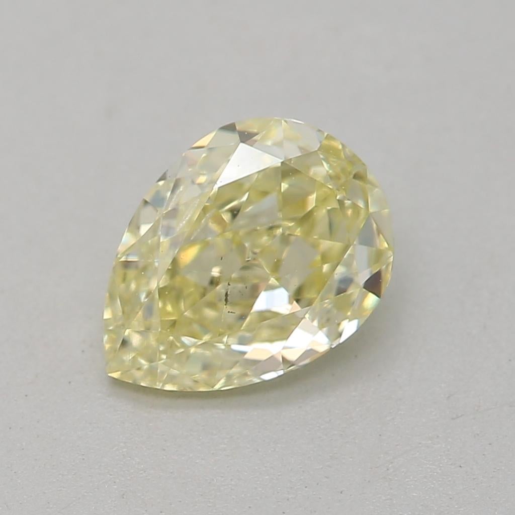 Women's or Men's GIA Certified 0.70 Carat Fancy Light Yellow I1 Clarity Diamond For Sale