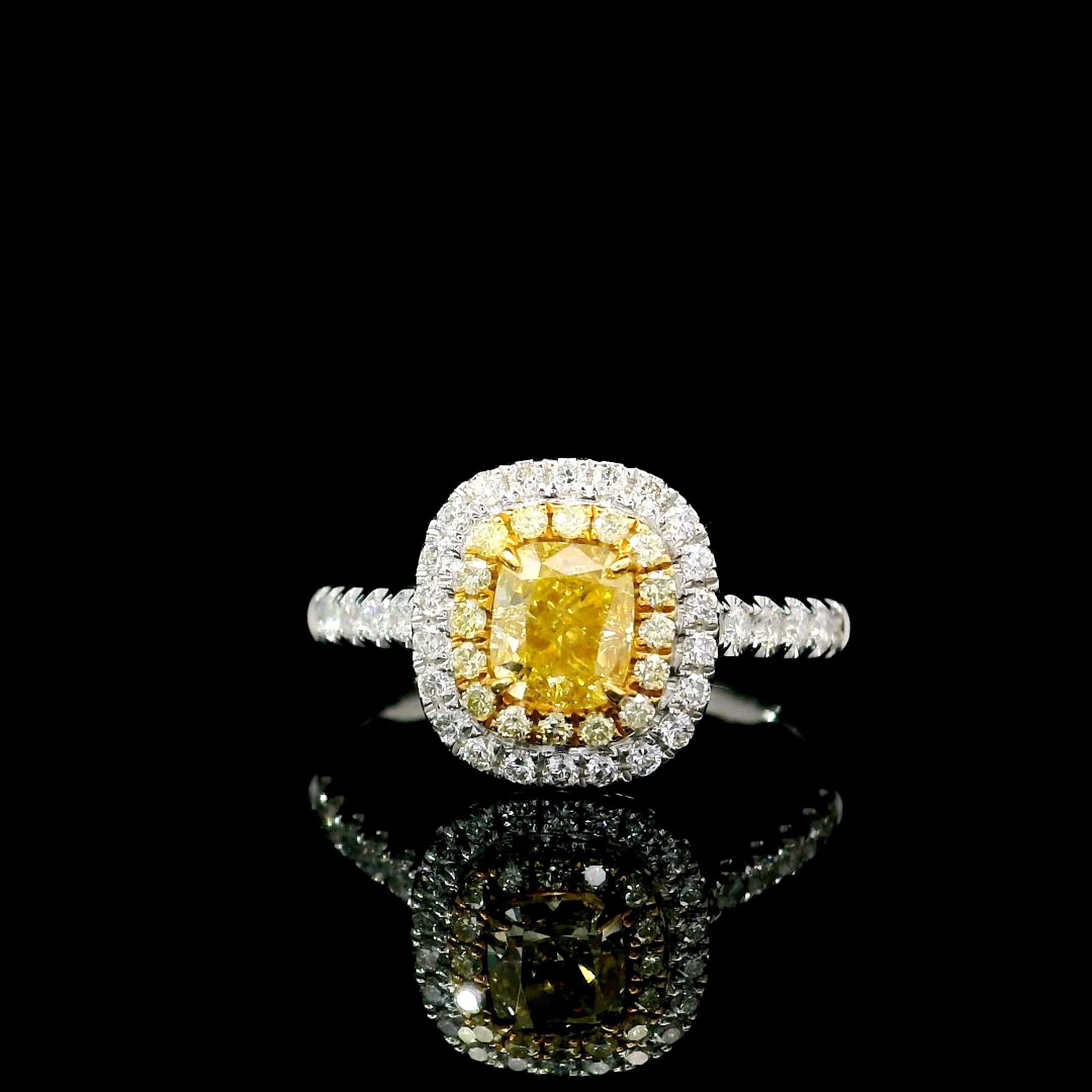 18kt white gold ring with diamonds
  
  Gold colour & karat: White gold 18kt
  Weight: 3.95 grams
  
  Set with-
  Stone type: Diamonds
  Shape: Cushion
  Carat: 0.70
  Colour: Fancy Light Yellow
  Clarity: VS1
  
  Surrounding Stones: Diamonds
 1)