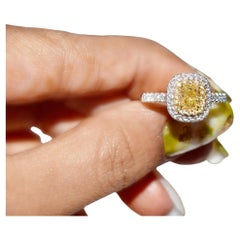 GIA Certified 0.70 Carat Fancy Light Yellow VS1 Clarity Diamond Ring