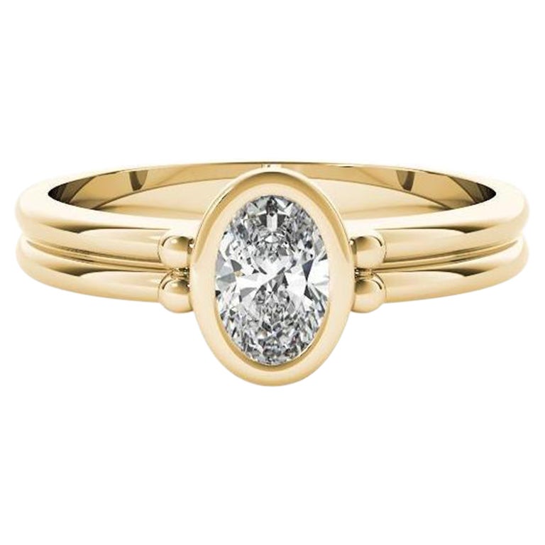 Anello con diamante a doppia fascia con castone ovale solitario certificato GIA da 0.70 carati