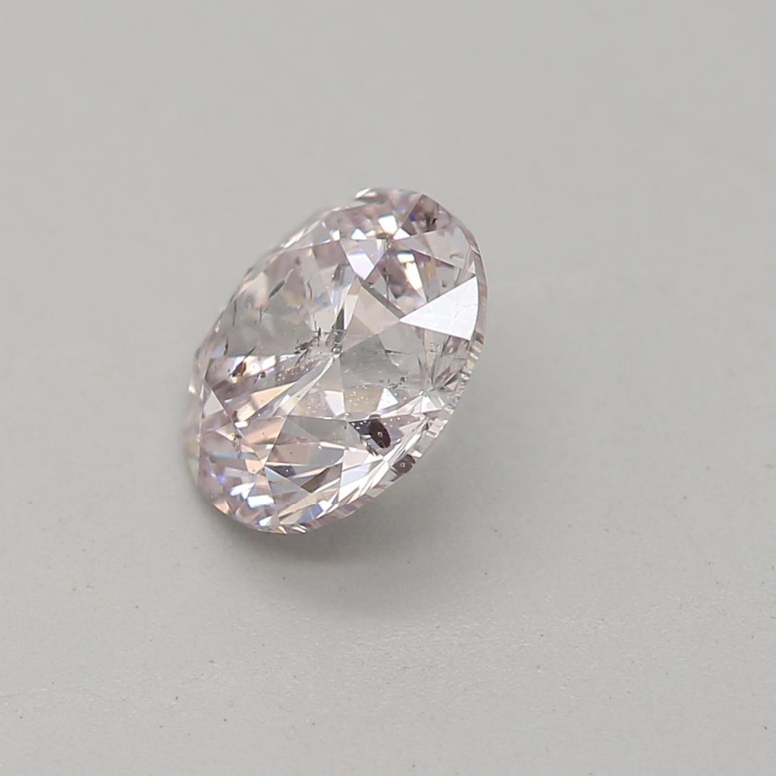 Round Cut GIA Certified 0.70 Carat Very Light Pink I1 Clarity Diamond For Sale
