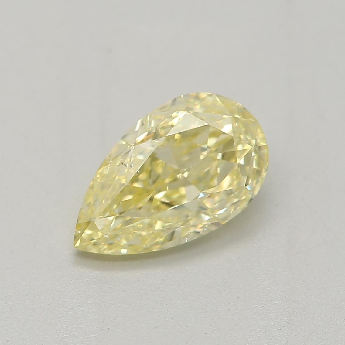 Certificate: GIA
Report Number: 7472506453
Shape And Cut: Pear
Carat Weight: 0.71 carat
Measurements: 7.54 x 4.52 x 2.83 mm
Color Grade: Fancy Yellow


This 0.71 carat diamond is a relatively small diamond but is quite beautiful. Its size makes it