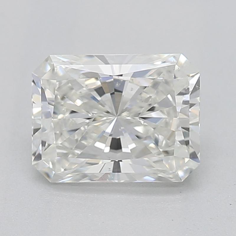 Handcrafted in New York, this exquisite diamond ring showcases a captivating radiant I SI1 0.71 center stone, brilliantly set in a classic four-prong setting that elevates its radiant beauty. The ring is elegantly adorned with shimmering tapered