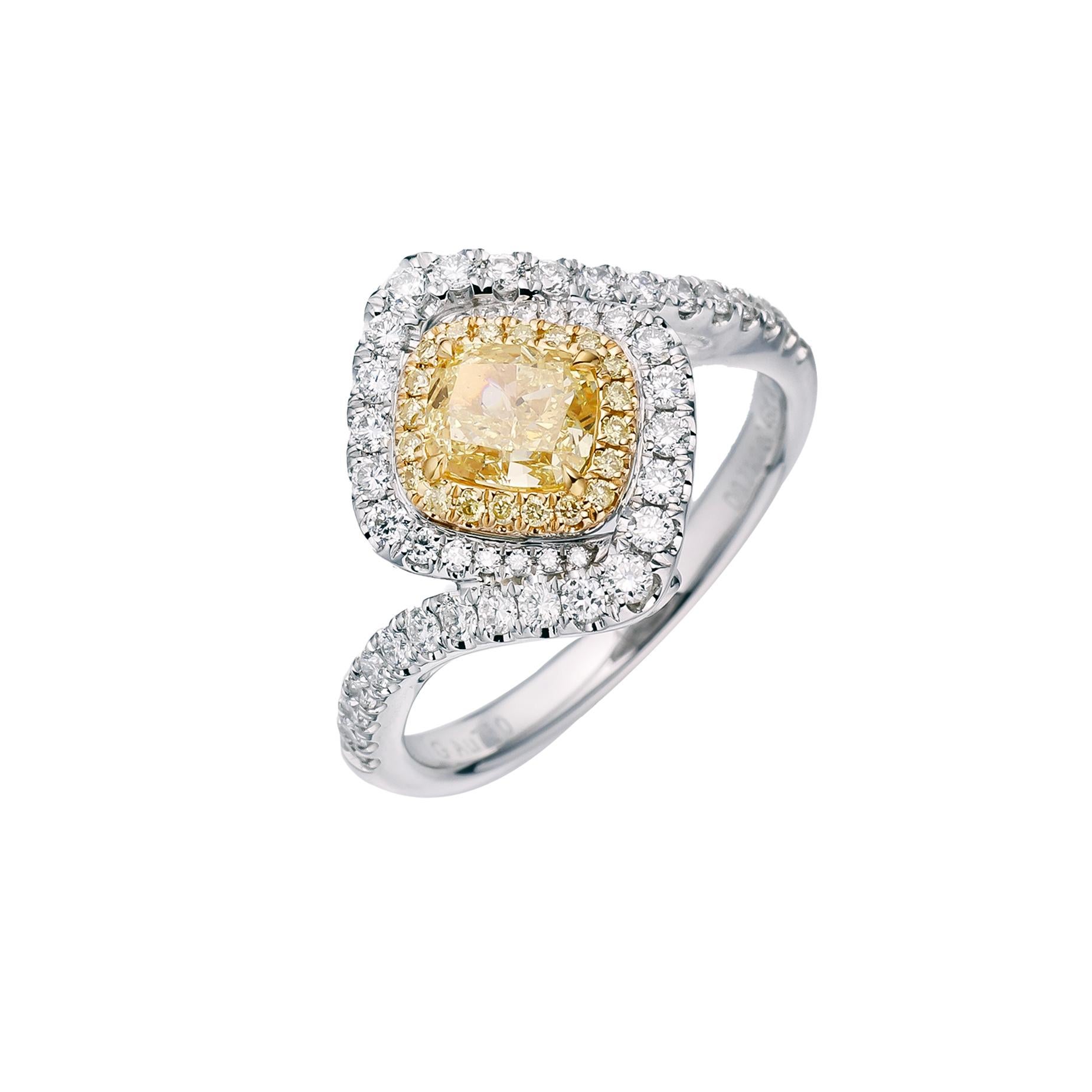 Elevate your style with a mesmerizing symbol of luxury and refinement – a GIA Certified 0.71 carat Fancy Intense Yellow Natural Cushion Cut Solitaire Diamond Ring. Crafted to perfection and set on an exquisite 18kt gold band, this ring is a true