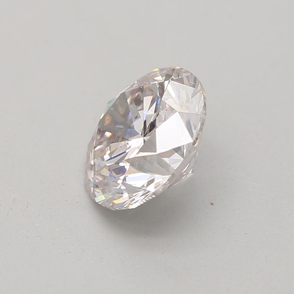 Round Cut GIA Certified 0.72 Carat Faint Pink SI2 Clarity Diamond For Sale