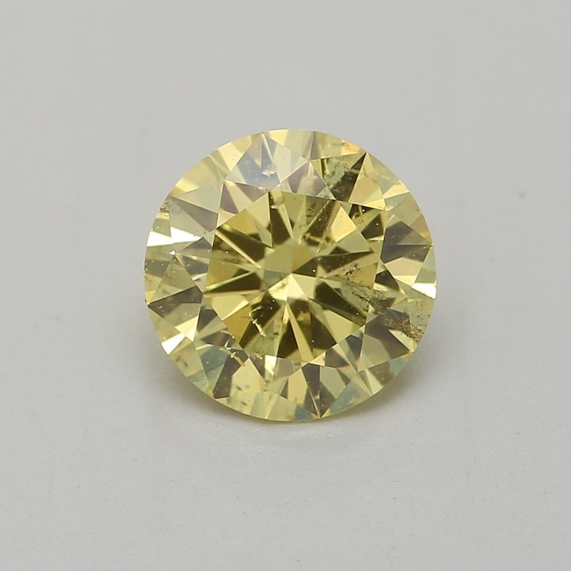 Certificate: GIA
Report Number: 2234591806
Shape And Cut: Round
Carat Weight: 0.72 carat
Measurements: 5.90 x 5.95 x 3.41 mm
Color Grade: Fancy Intense Yellow

This Fancy Intense Yellow Diamond is a type of colored diamond known for its rich and