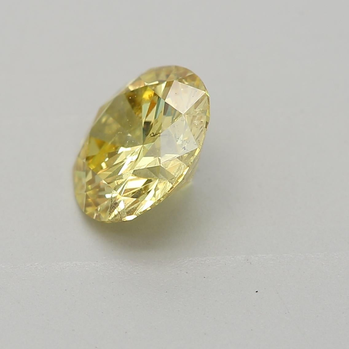 Round Cut GIA Certified 0.72 Carat Fancy Intense Yellow SI2 Clarity Diamond For Sale