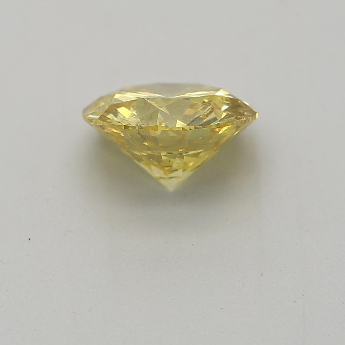 GIA Certified 0.72 Carat Fancy Intense Yellow SI2 Clarity Diamond In New Condition For Sale In บางรัก, TH