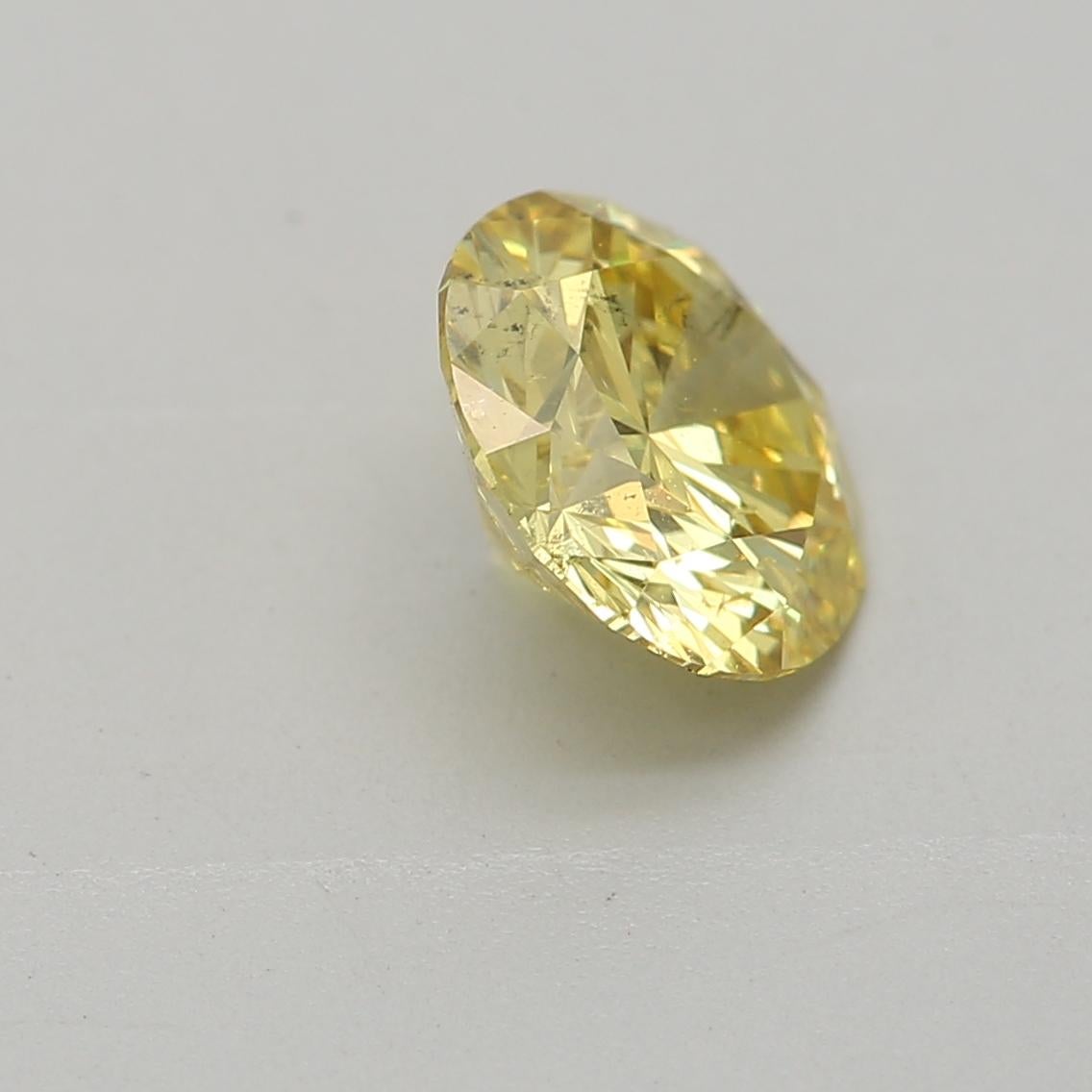 Women's or Men's GIA Certified 0.72 Carat Fancy Intense Yellow SI2 Clarity Diamond For Sale