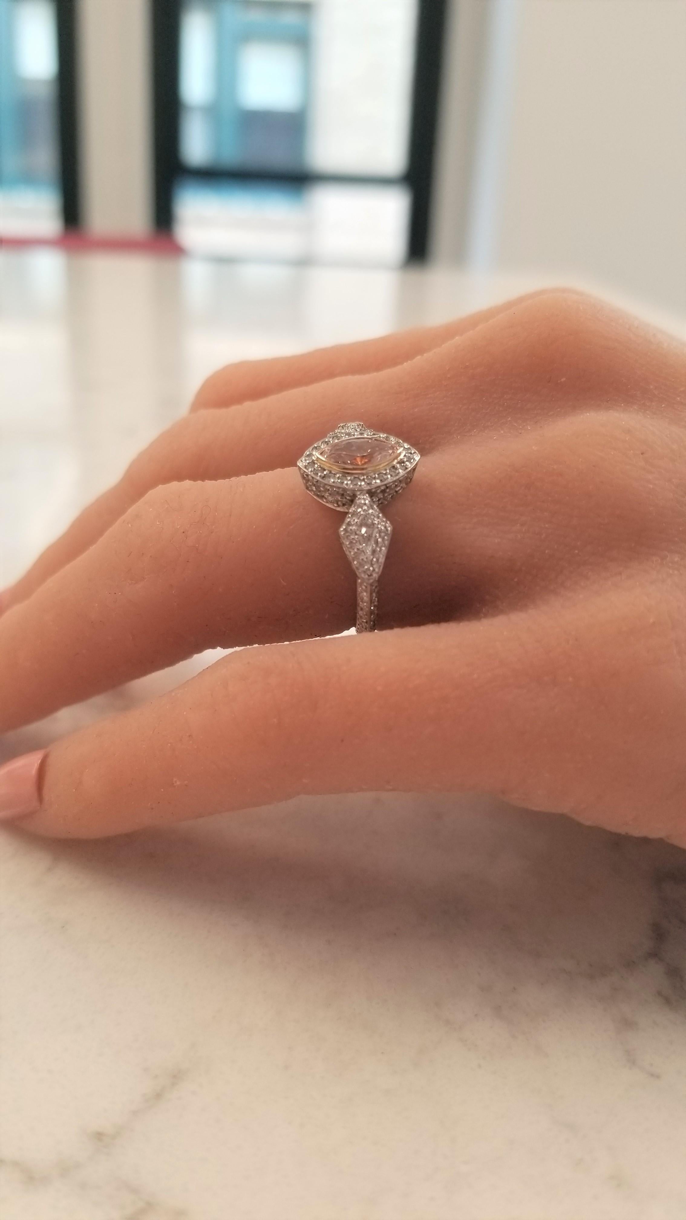 What’s not to love about this spectacular vintage-inspired ring? Set in luxurious platinum & 18 Karat rose gold, this Australian 0.73 carat marquise-cut pink diamond is stunning! The blush color of the center diamond elevates the interest of the
