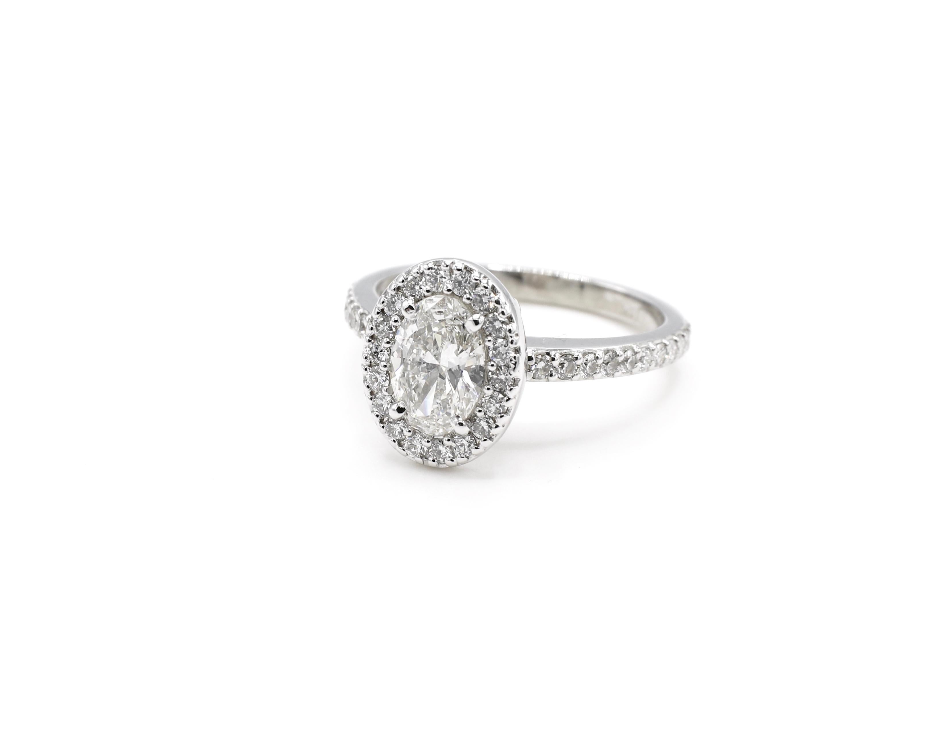 Modern GIA Certified 0.73 Carat Oval Diamond Halo Engagement Ring