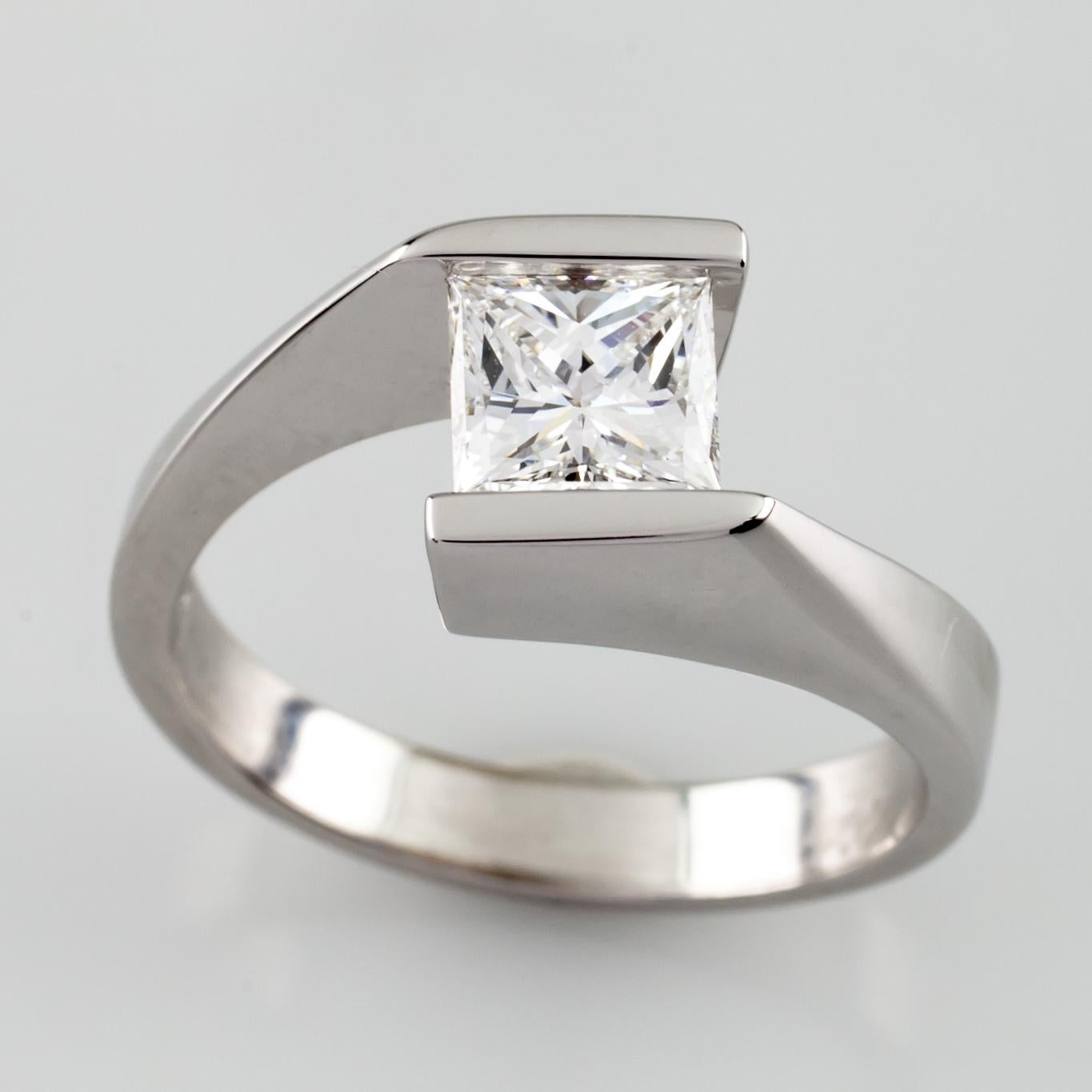 Gorgeous Solitaire Princess Cut Engagement Ring
Ring Size 5
Total Mass = 4.24 grams
Center Stone Details:
Cut: Square Modified Brilliant (Princess)
Size: .73 Carats
Color: E (Colorless)
Clarity: VVS2
Polish: Excellent
Symmetry: Very Good
Amazing