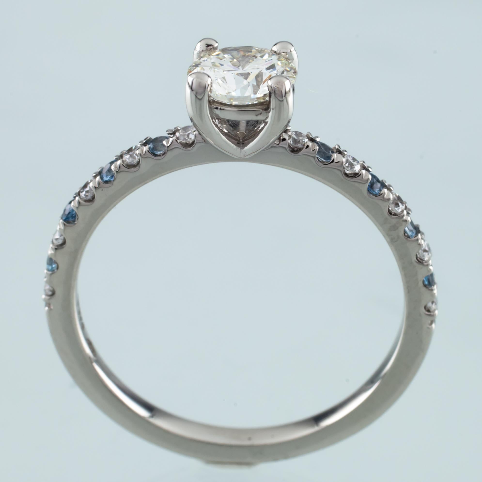 diamond engagement ring with aquamarine accents