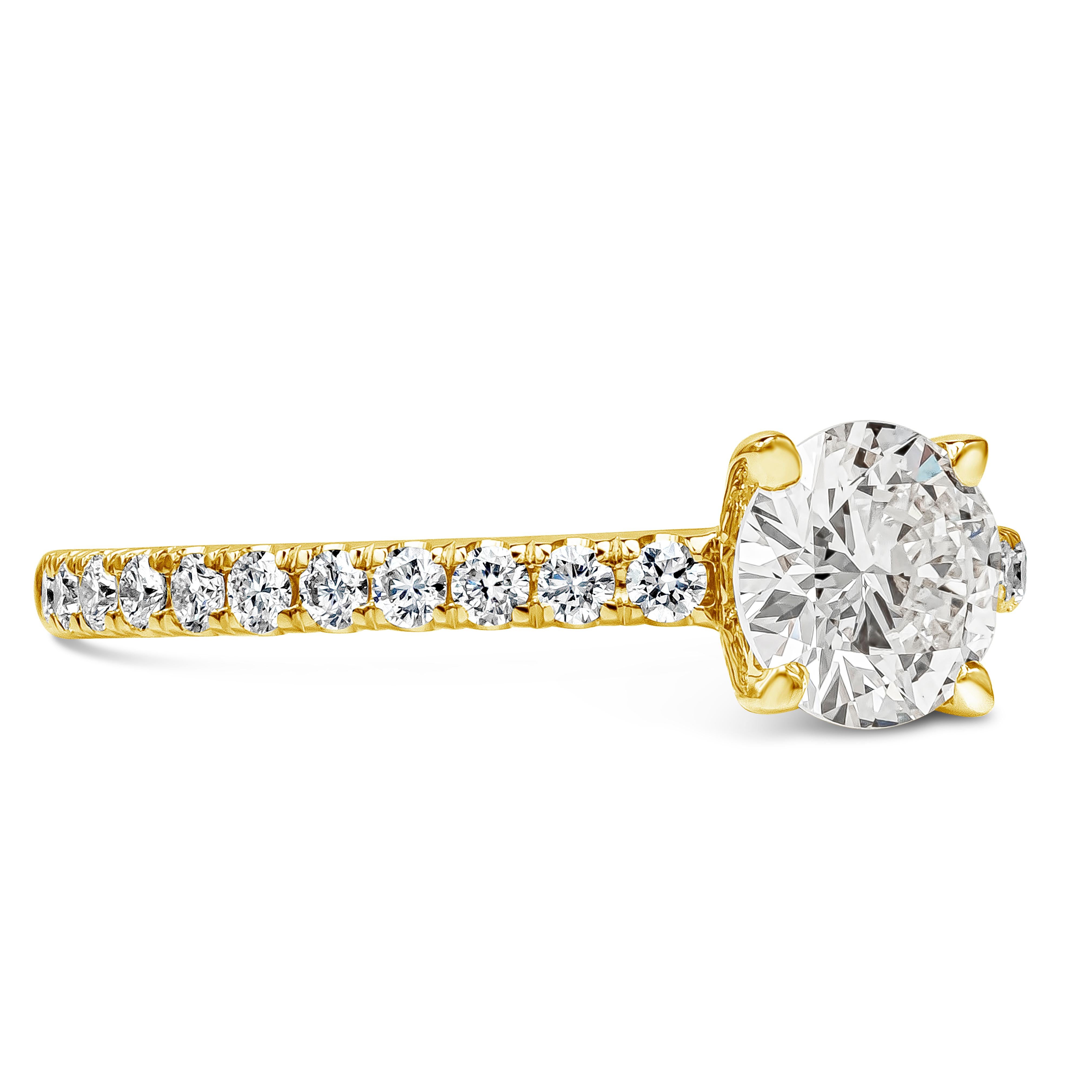 A classic engagement ring style showcasing a 0.73 carats round brilliant diamond certified by GIA as I color, VS1 in clarity. Center diamond is set in a polished 18k yellow gold setting accented with round diamonds weighing 0.35 carats total. Size