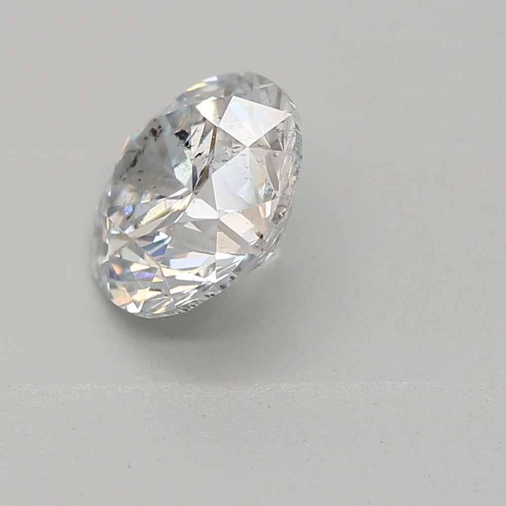 Round Cut GIA Certified 0.74 Carat Very Light Blue I1 Clarity Diamond For Sale