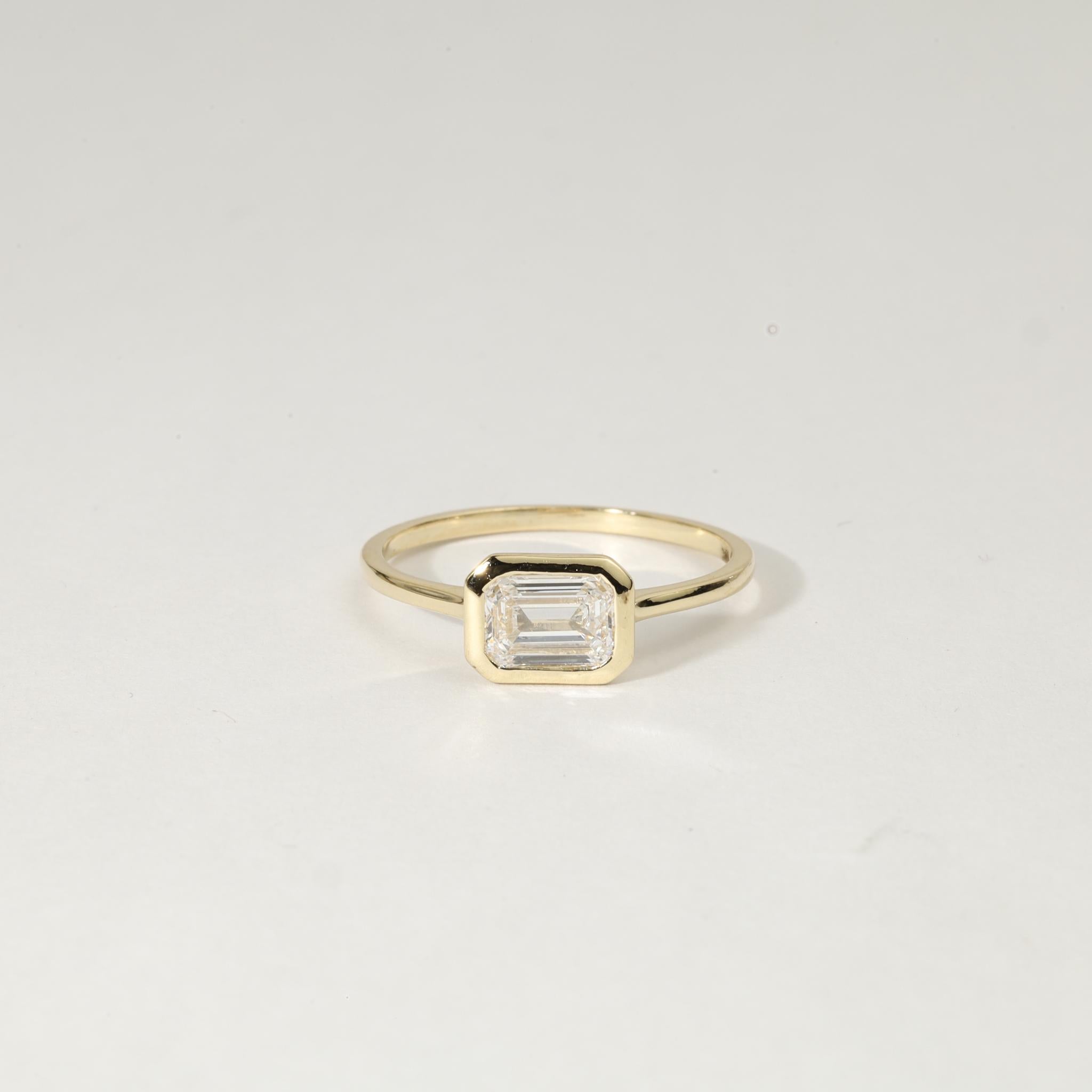 Elegance minimaliste. Romance intemporelle. Fabriqué pour l'éternité.

Célébrez votre histoire avec la sophistication tranquille de cette bague solitaire en diamant naturel certifié GIA de 0,75ct de taille émeraude, sertie dans de l'or jaune 18K